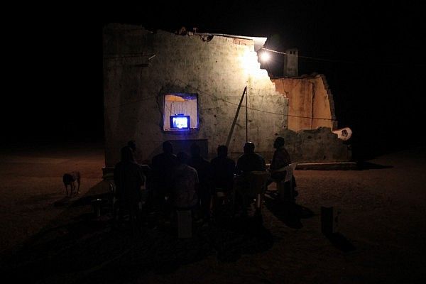 Watching TV at a bombed out police station